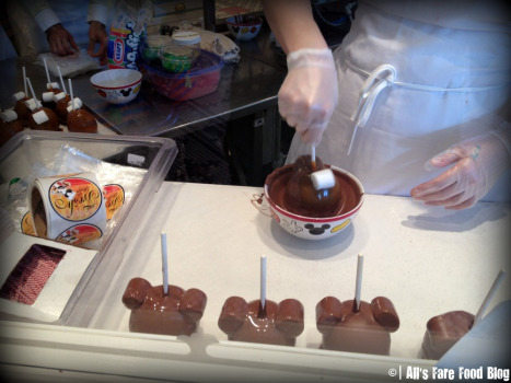 Making dipped apples at Magic Kingdom